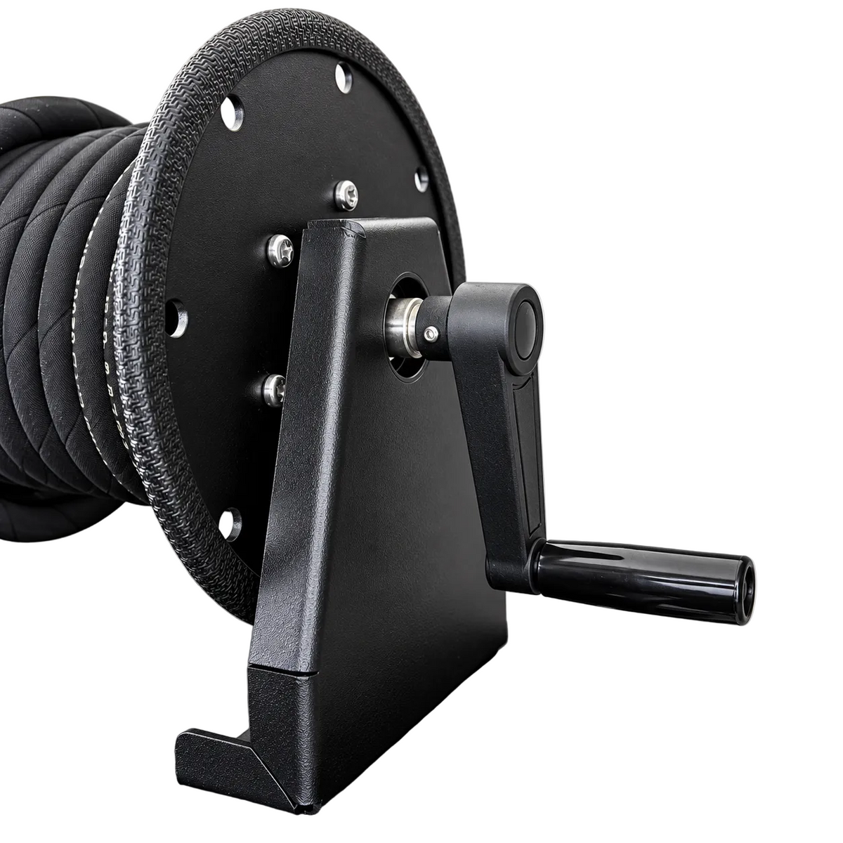 Paddock™ 1,450 PSI Wall Mountable Pressure Washer with Hose Reel, featuring a black wall-mountable high-pressure hose reel with a hand crank and a coiled black pressure hose.